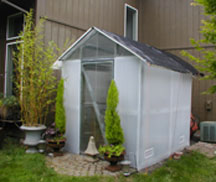 Greenhouse with shade cloth attached