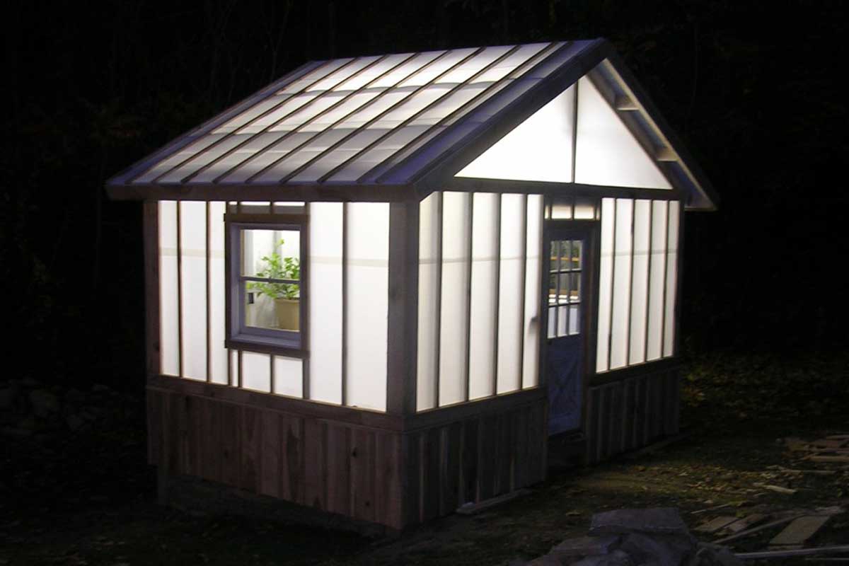 solexx custom greenhouse lit up at night