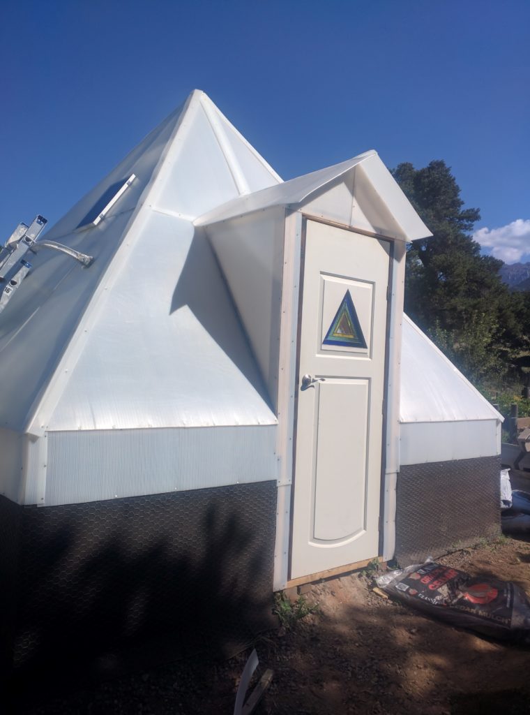 Custom greenhouse design with pyramid style roof using solexx panels