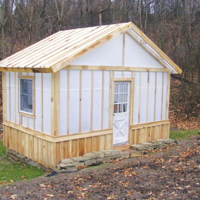 A custom wood framed greenhouse using Solexx panels as the greenhouse covering