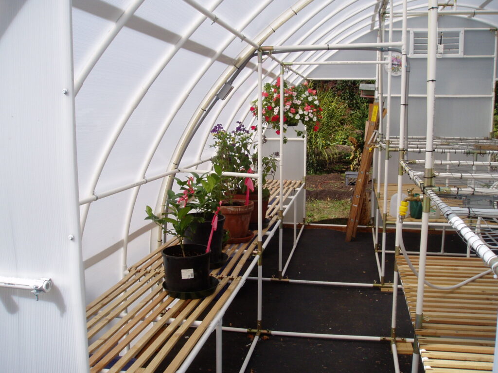 The side shelves inside the greenhouse